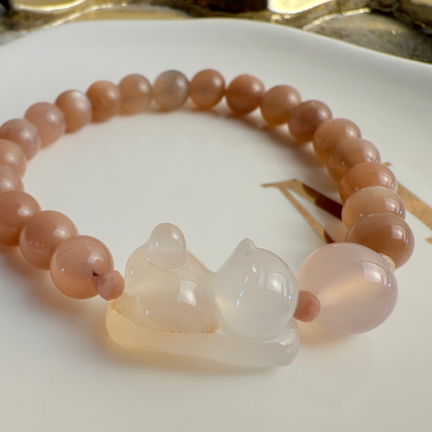 Playing Kitty: Orange moonstone, paw print bead bracelet